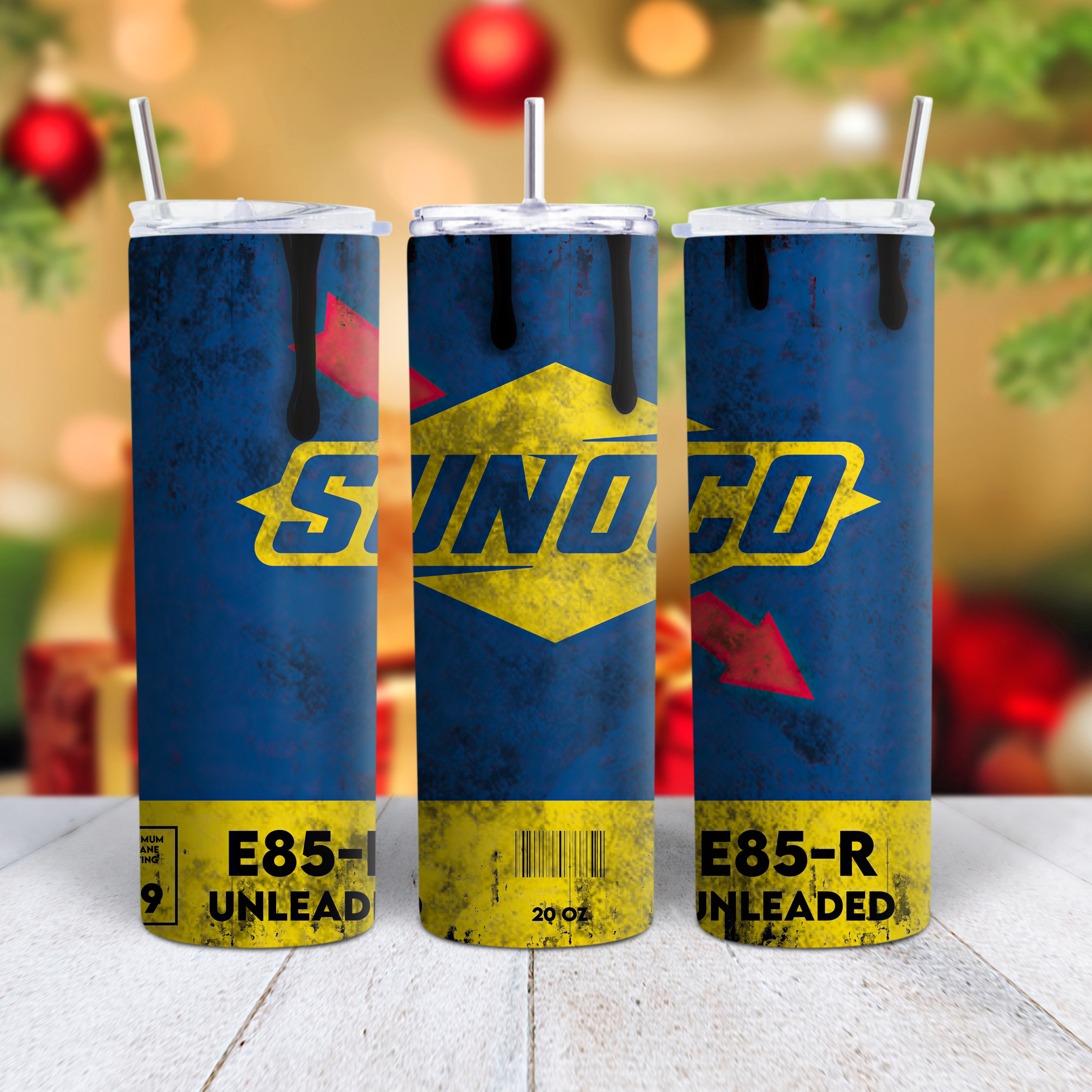  blue tumblers with Sunoco branding on a wooden surface with a festive background.
